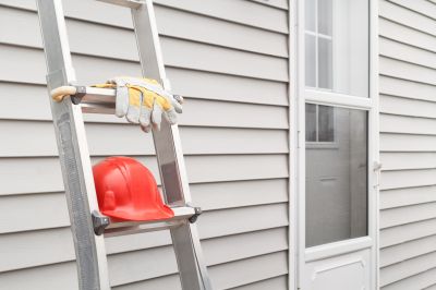 Siding installation on a multi-story building